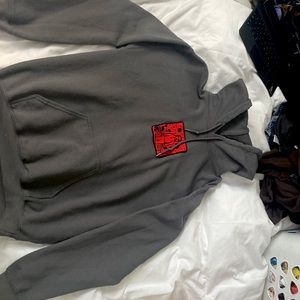 Grey girl in red hoodie from Warner music Australia.